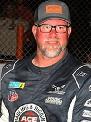 Jonathon D Jonathan Davenport wearing Deatherage Certified Opticians racing glasses in his racing suit during a post-race interview.